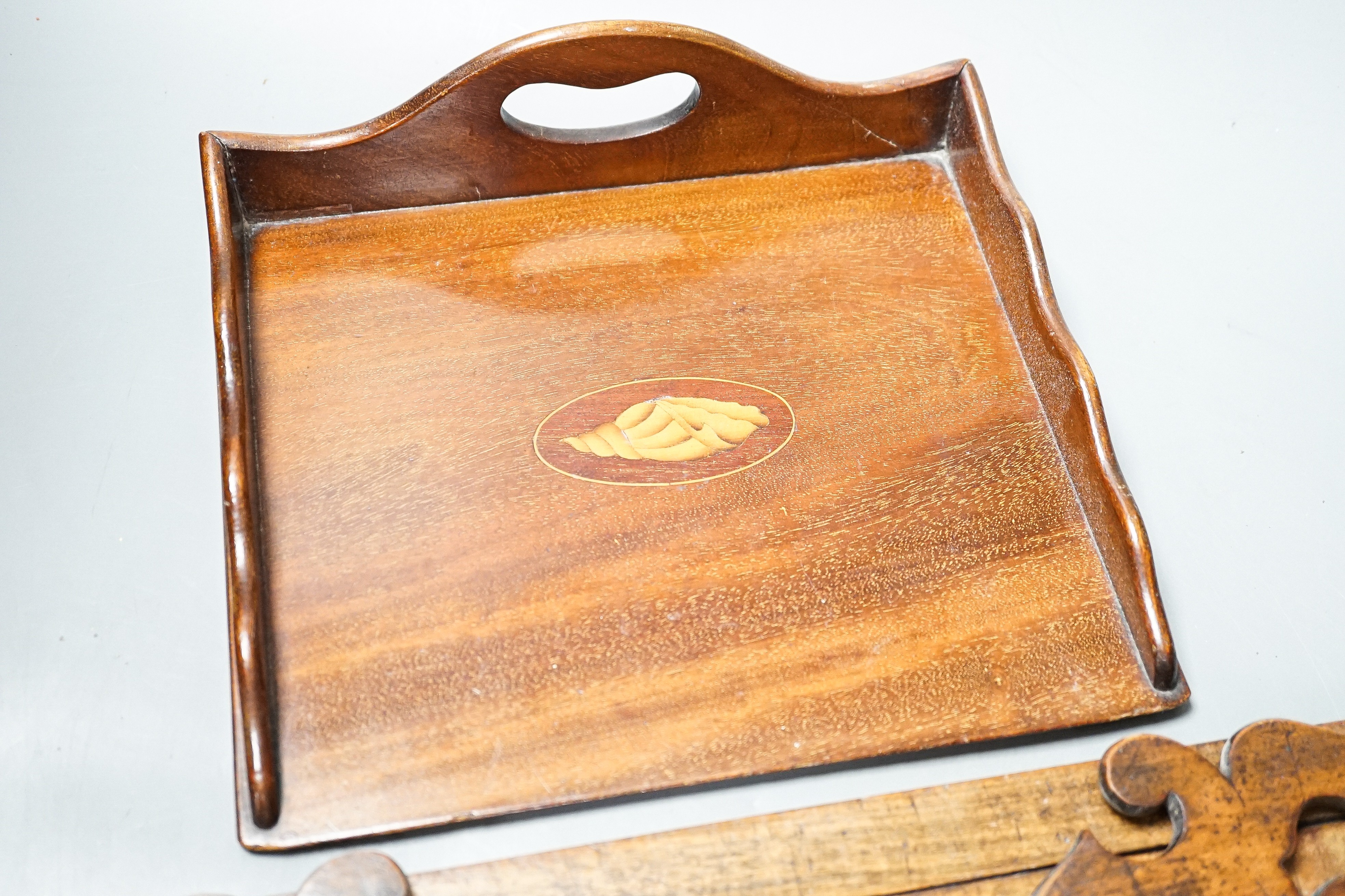 A Victorian walnufolding bookslide and an inlaid mahogany tray, largest 40cms wide.